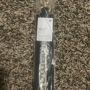 lululemon athletica Black and Gold Keychain